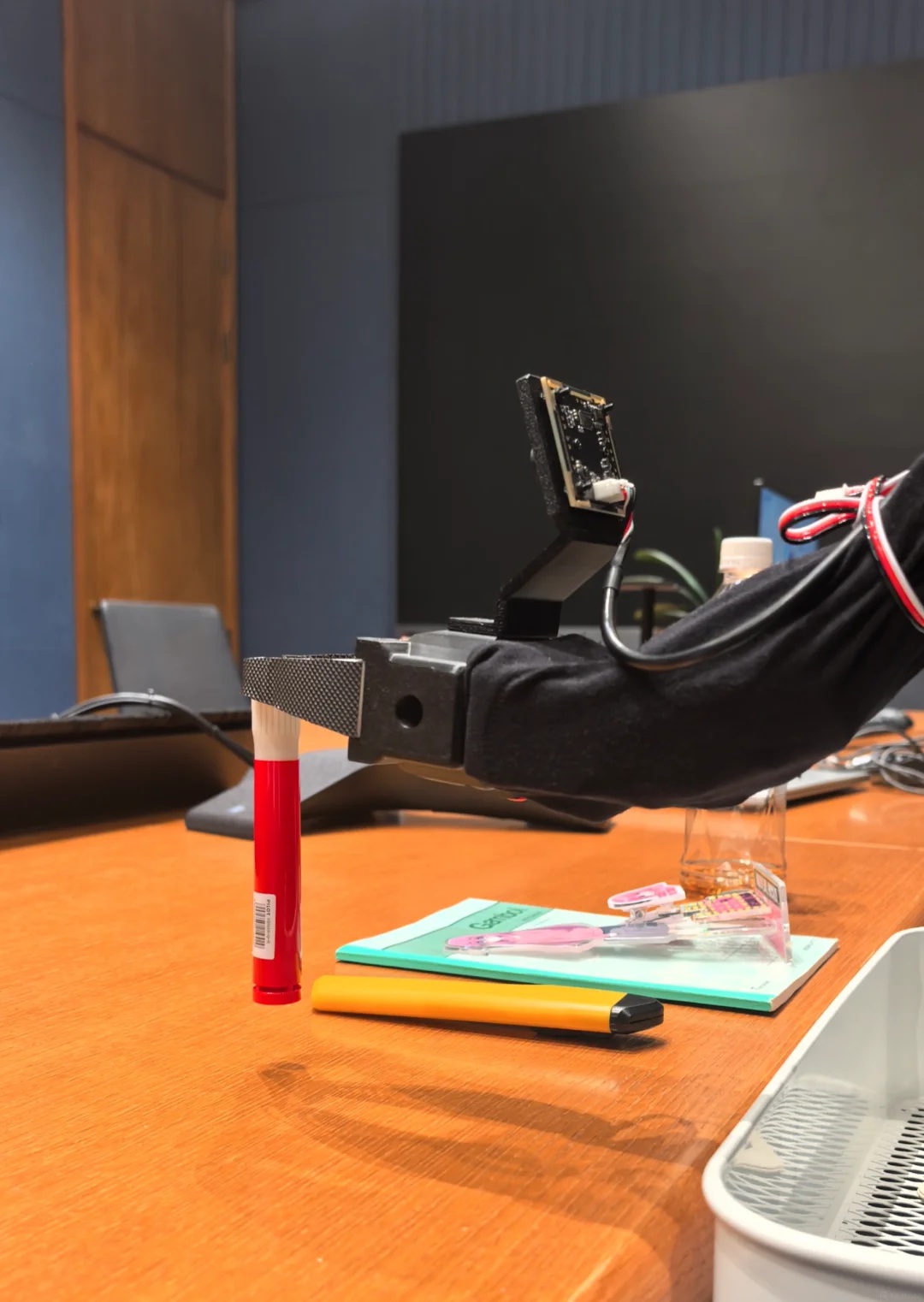 Robot arm grasping a marker
